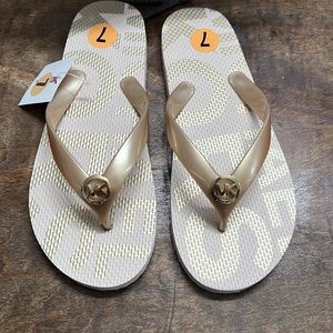 Micheal Kors Gold and cream flip flops size 7